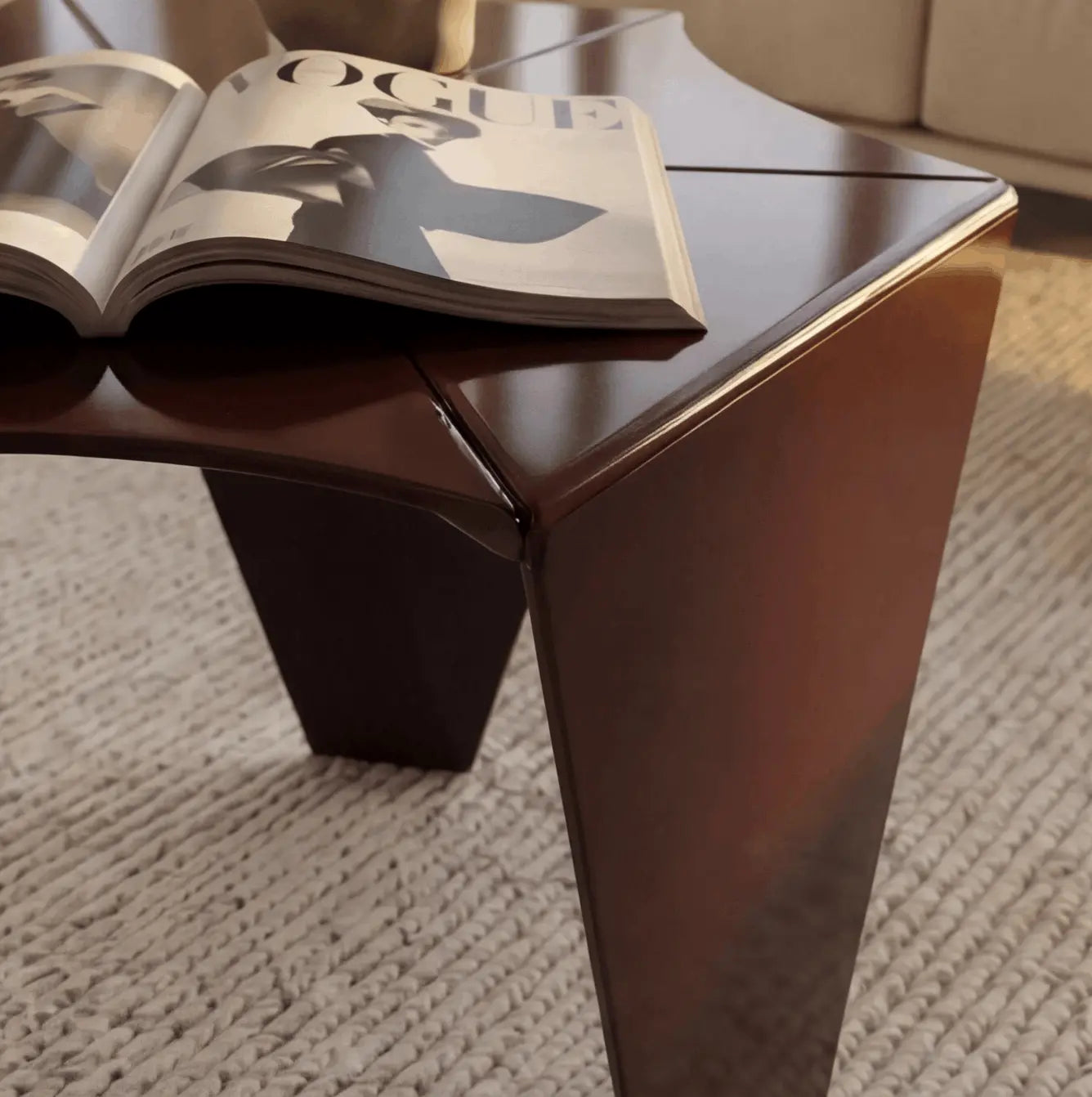 Close-up of the Ferrani Mono Fold side table showing faceted folded edge in high-gloss mahogany