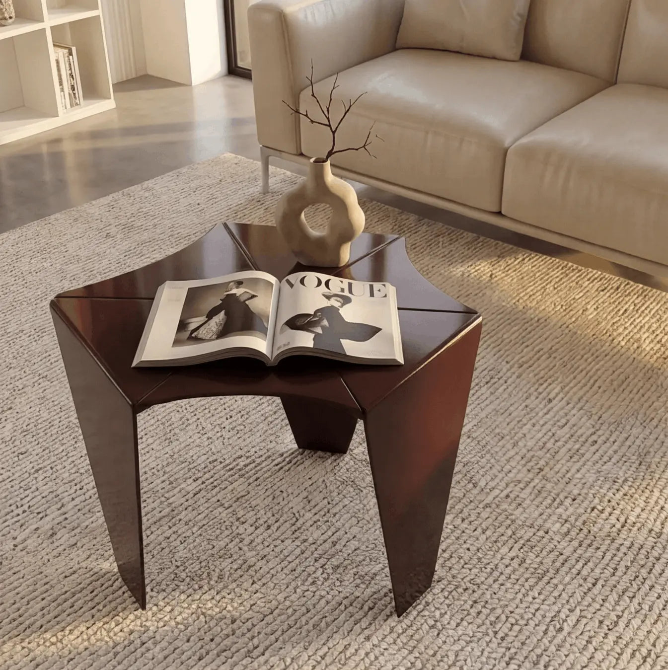 Ferrani Mono Fold sculptural steel side table in mahogany lacquer, styled in a modern living room with sofa