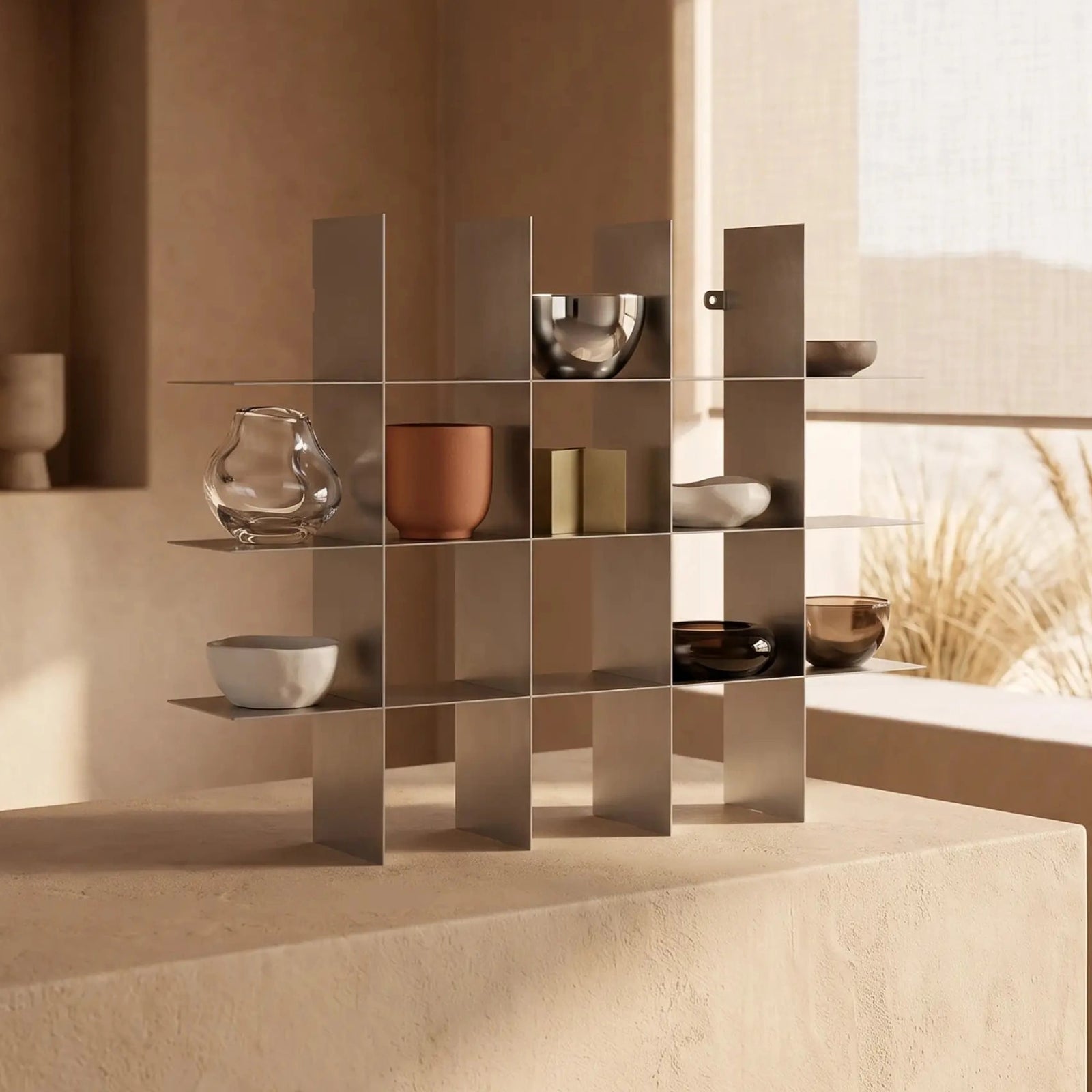 Modern stainless steel mug shelf styled in a warm beige interior with decorative mugs and minimalist home decor.